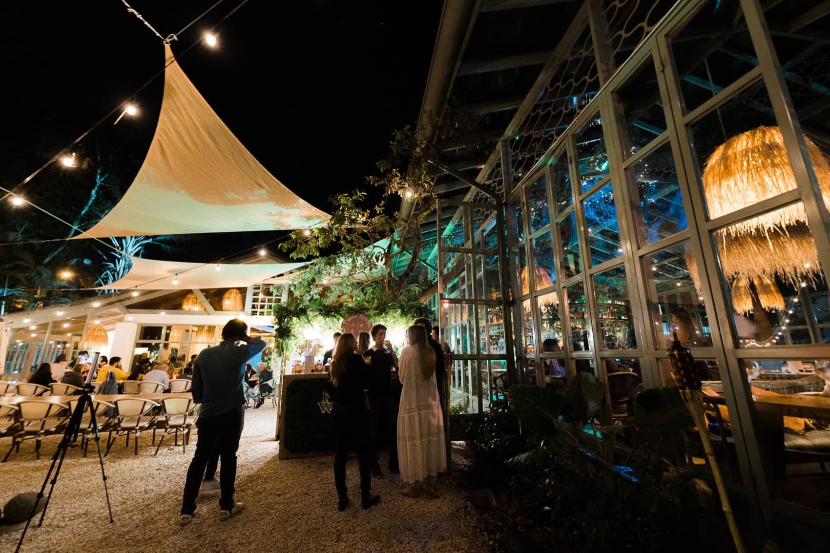 A Costa Spirits event under string lights at night